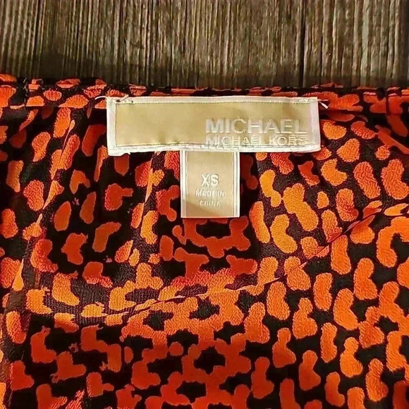 Womens Michael Kors Orange Black Print Peplum Knit Poly Top XS - Picture 2 of 4